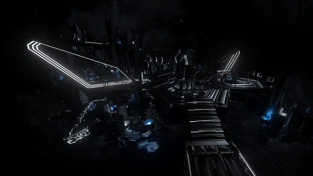 Dark futuristic structure with glowing blue and white light lines at night, sci-fi mood
